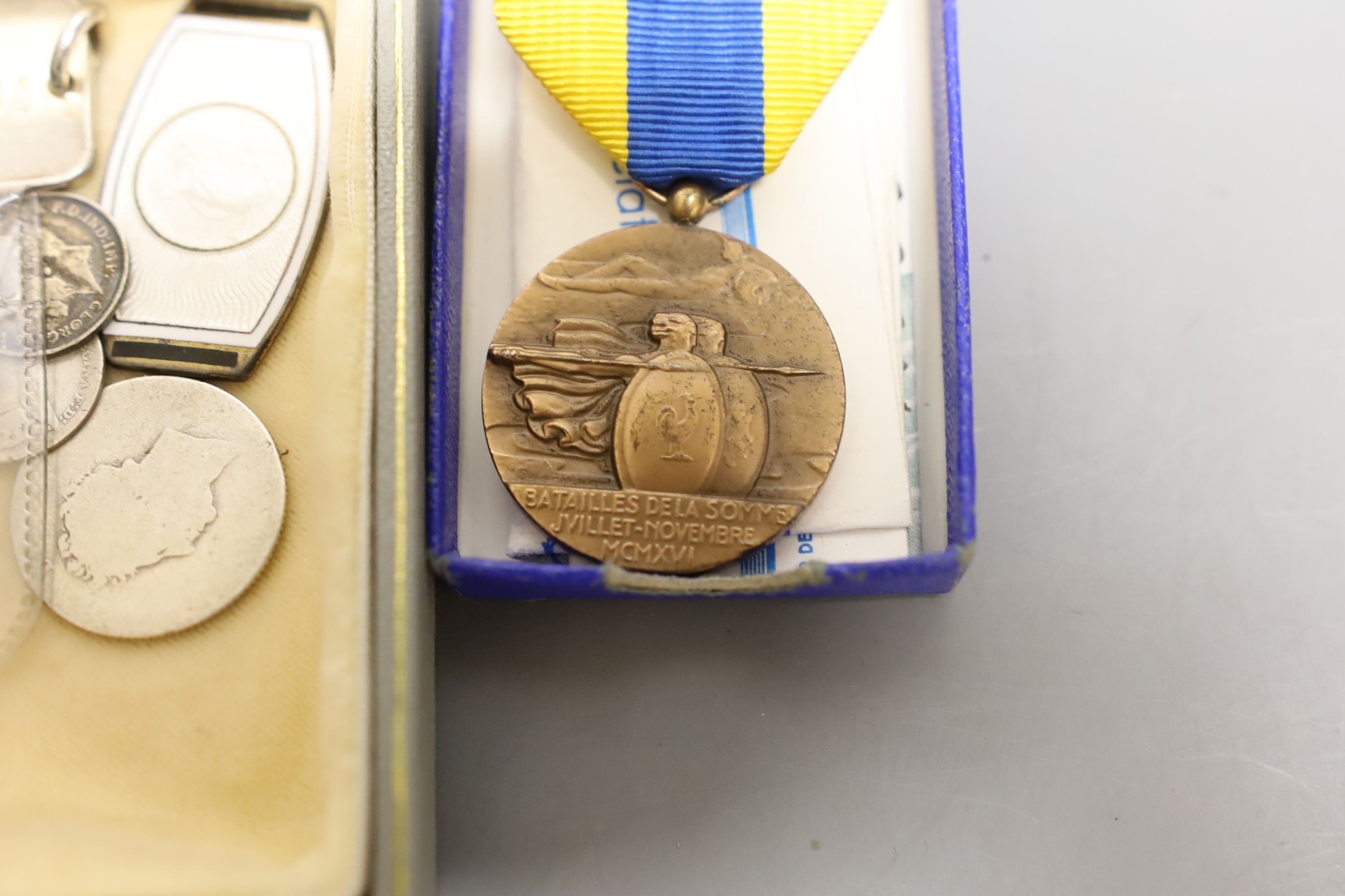 A group of silver medallions and silver coins including two crowns